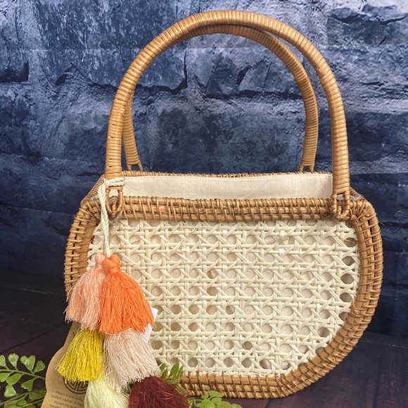 Crescent Woven Handbag with tassel detail and cinch bag interior - Picture 11 of 11